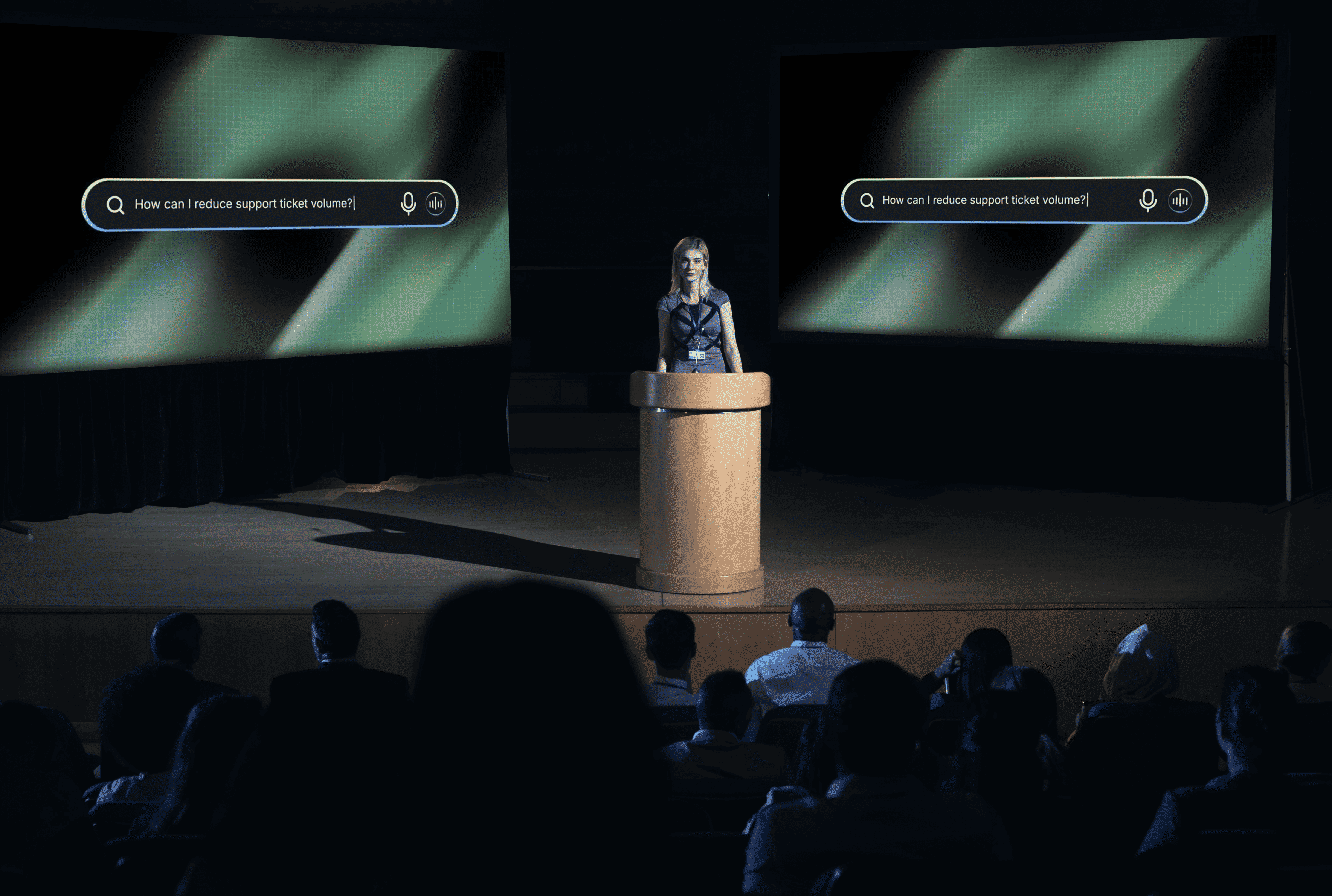 Speaker presenting in front of a large event screen